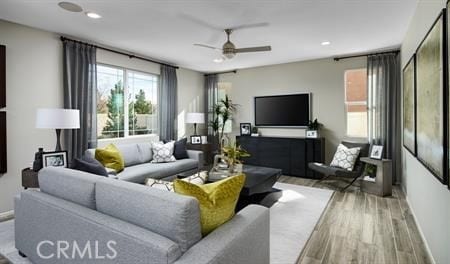 614 Clarence Muse Loop, Perris, CA 92570 - living area with ceiling fan, wood finished floors, baseboards, and recessed lighting
