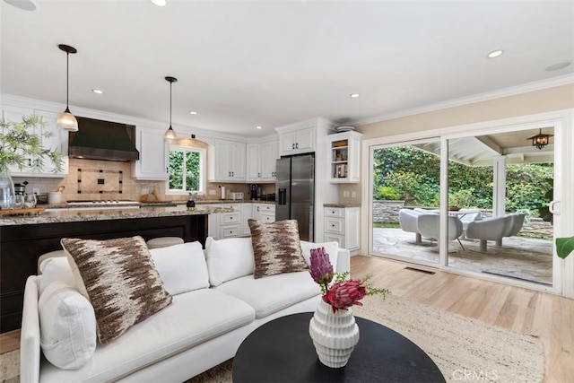 1981 San Remo, Laguna Beach, CA 92651 - living area with light wood-style floors, ornamental molding, and recessed lighting