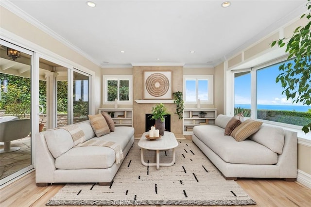 1981 San Remo, Laguna Beach, CA 92651 - living room featuring light wood finished floors, a water view, recessed lighting, and crown molding