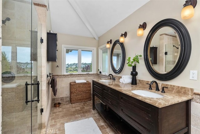 1981 San Remo, Laguna Beach, CA 92651 - bathroom featuring double vanity, a stall shower, tile walls, brick patterned floors, and a wainscoted wall