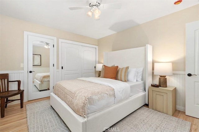 1981 San Remo, Laguna Beach, CA 92651 - bedroom with wainscoting, light wood finished floors, a closet, and ceiling fan