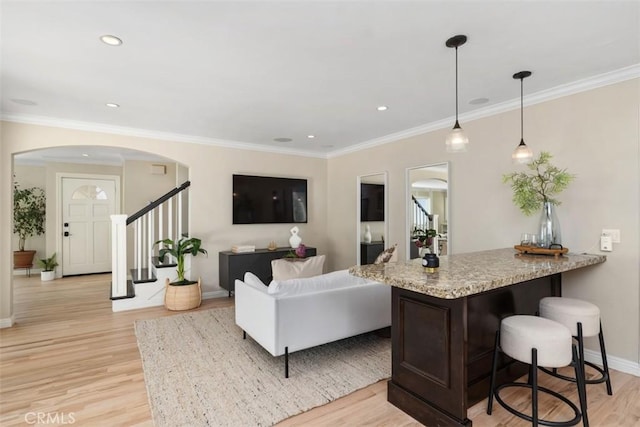 1981 San Remo, Laguna Beach, CA 92651 - living room with arched walkways, light wood-type flooring, stairway, crown molding, and recessed lighting