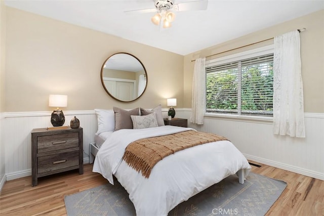 1981 San Remo, Laguna Beach, CA 92651 - bedroom featuring wainscoting, wood finished floors, and ceiling fan