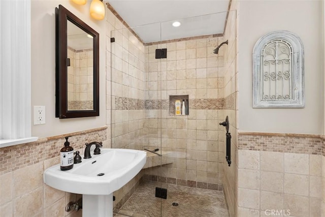 1981 San Remo, Laguna Beach, CA 92651 - bathroom featuring tile walls, a shower stall, and a wainscoted wall
