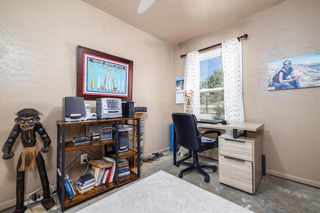 61961 Aster Pl, Joshua Tree, CA 92252 - office area featuring unfinished concrete flooring and baseboards