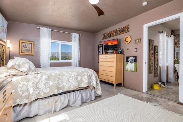 61961 Aster Pl, Joshua Tree, CA 92252 - bedroom featuring unfinished concrete floors and a ceiling fan