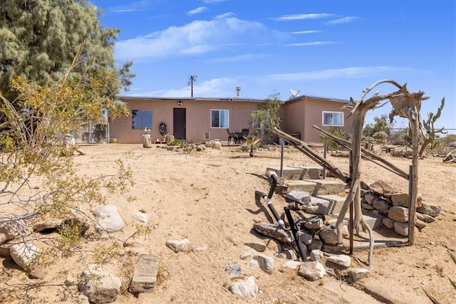 61961 Aster Pl, Joshua Tree, CA 92252 - rear view of house with stucco siding