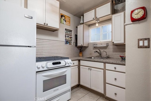 61961 Aster Pl, Joshua Tree, CA 92252 - kitchen featuring white appliances, a sink, decorative backsplash, light tile patterned floors, and white cabinets