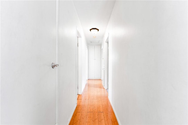 17331 Newland St, Huntington Beach, CA 92647 - hallway with baseboards and light wood-type flooring