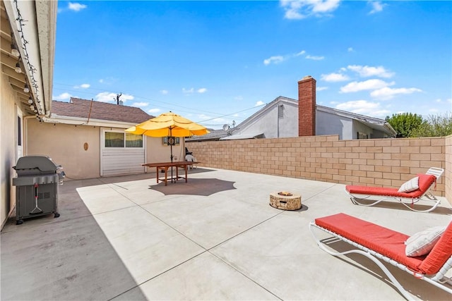 17331 Newland St, Huntington Beach, CA 92647 - view of patio / terrace with fence, a grill, and an outdoor fire pit