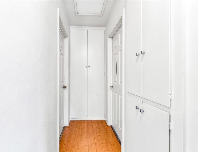17331 Newland St, Huntington Beach, CA 92647 - corridor featuring light wood finished floors