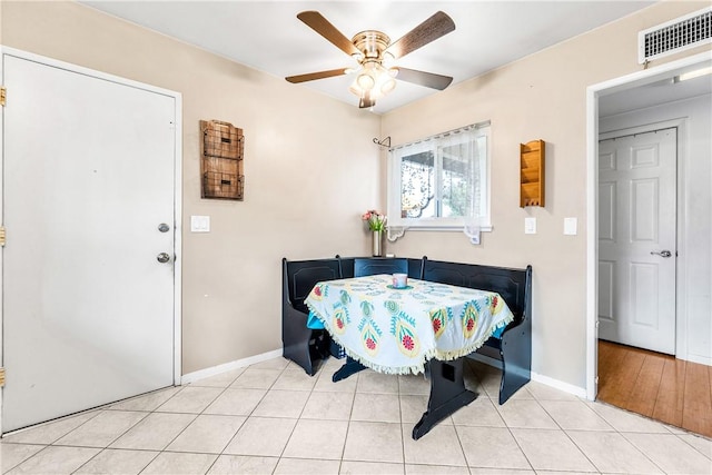 17331 Newland St, Huntington Beach, CA 92647 - dining room featuring baseboards, a ceiling fan, and light tile patterned floors