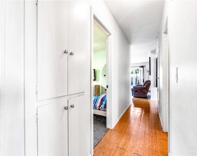 17331 Newland St, Huntington Beach, CA 92647 - hall with light wood-style floors and baseboards