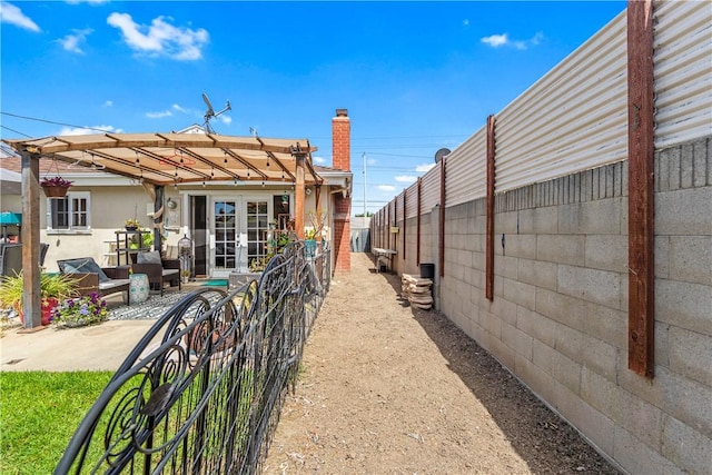 17331 Newland St, Huntington Beach, CA 92647 - rear view of house with french doors, fence, a patio, and a chimney