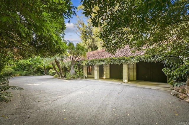 6036 Rainbow Heights Rd, Fallbrook, CA 92028 - view of front of house with a tile roof and a garage