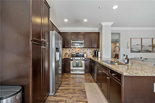 27423 Larabee Ct Unit 3, Murrieta, CA 92562 - kitchen featuring appliances with stainless steel finishes, a sink, dark wood-style flooring, a peninsula, and recessed lighting