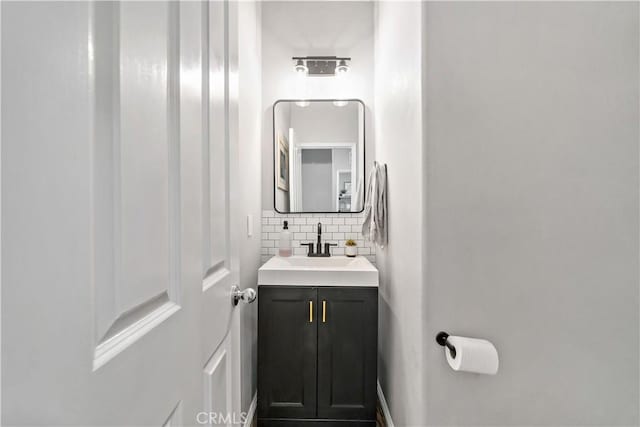 27423 Larabee Ct Unit 3, Murrieta, CA 92562 - bathroom with decorative backsplash and vanity