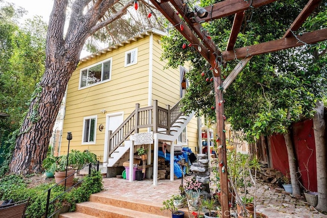 22460 Venido Rd, Woodland Hills, CA 91364 - rear view of property with stairway and a patio area