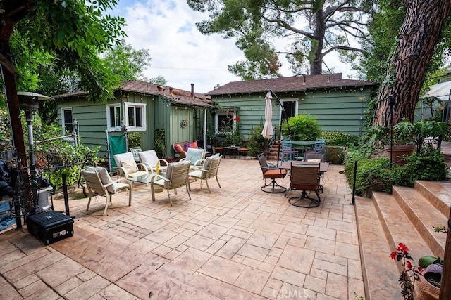 22460 Venido Rd, Woodland Hills, CA 91364 - view of patio / terrace featuring an outbuilding and outdoor dining space