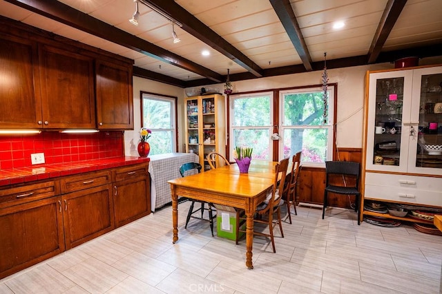 22460 Venido Rd, Woodland Hills, CA 91364 - dining room featuring beamed ceiling and a wainscoted wall