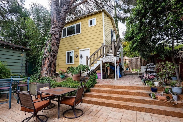 22460 Venido Rd, Woodland Hills, CA 91364 - rear view of property with outdoor dining space, stairs, and a patio