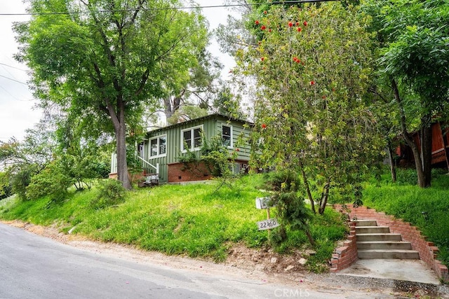 22460 Venido Rd, Woodland Hills, CA 91364 - view of front of property featuring board and batten siding and stairway