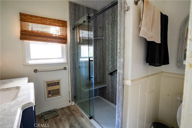22460 Venido Rd, Woodland Hills, CA 91364 - full bathroom featuring a stall shower, toilet, heating unit, vanity, and wainscoting
