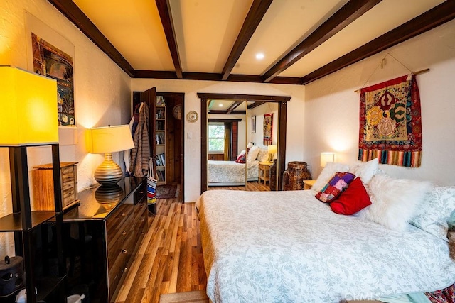 22460 Venido Rd, Woodland Hills, CA 91364 - bedroom with wood finished floors and beamed ceiling