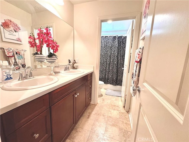 18016 Ribwort Rd, San Bernardino, CA 92407 - bathroom with toilet, double vanity, and a shower with curtain