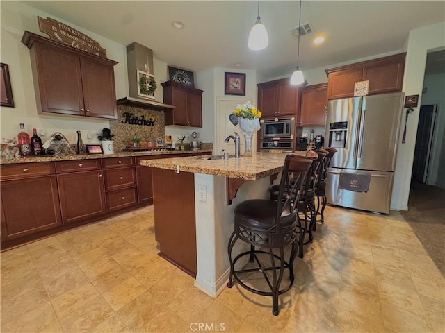 18016 Ribwort Rd, San Bernardino, CA 92407 - kitchen featuring stainless steel appliances, a sink, wall chimney exhaust hood, tasteful backsplash, and light stone countertops