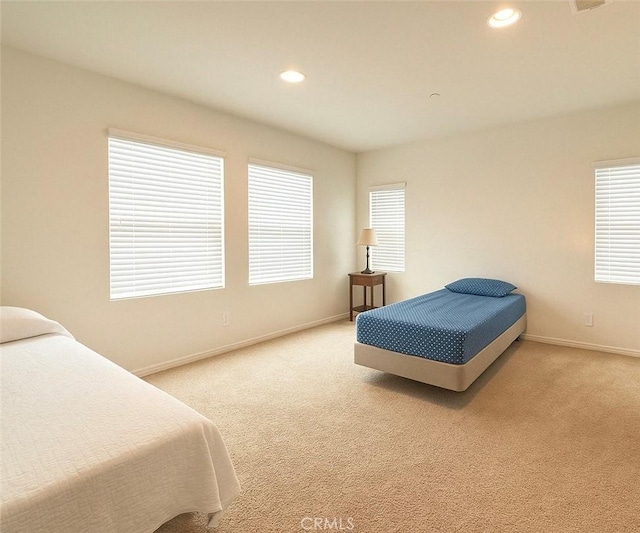 18016 Ribwort Rd, San Bernardino, CA 92407 - bedroom with baseboards, light carpet, recessed lighting, and multiple windows