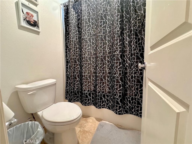 18016 Ribwort Rd, San Bernardino, CA 92407 - bathroom with toilet and tile patterned floors