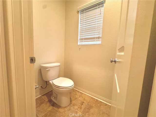 18016 Ribwort Rd, San Bernardino, CA 92407 - bathroom with baseboards and toilet