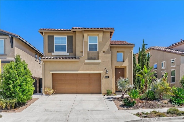 30589 Ticonderoga Ct, Murrieta, CA 92563 - view of front of home with a tile roof, stucco siding, an attached garage, and driveway