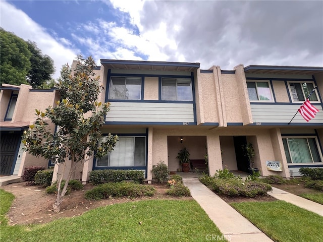 1007 Harrington Way, West Covina, CA 91792 - townhome / multi-family property with stucco siding and a front lawn