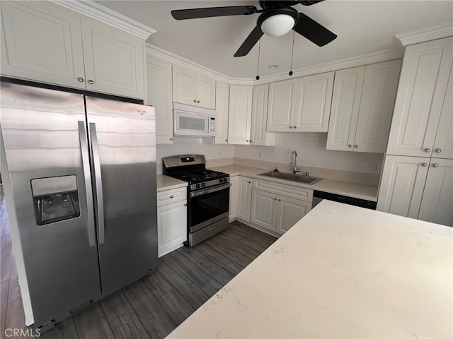 1007 Harrington Way, West Covina, CA 91792 - kitchen featuring stainless steel appliances, a sink, light countertops, white cabinetry, and dark wood-style floors