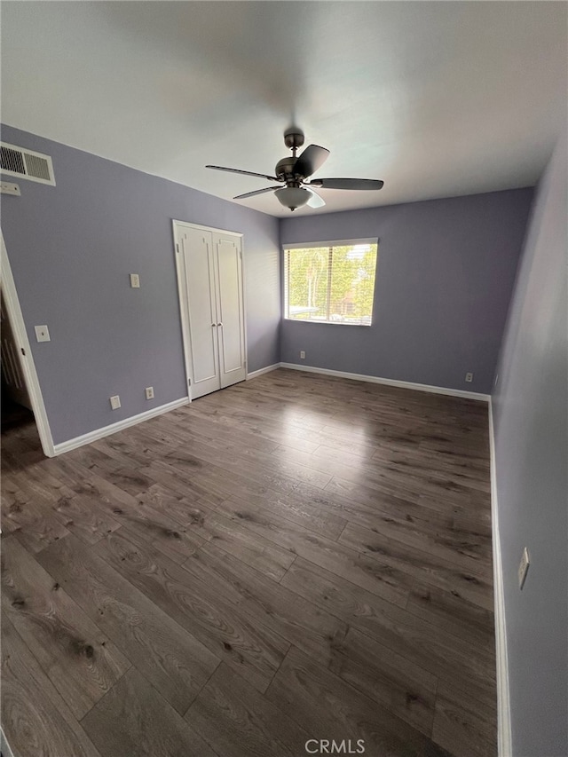 1007 Harrington Way, West Covina, CA 91792 - unfurnished bedroom with dark wood finished floors, baseboards, and ceiling fan