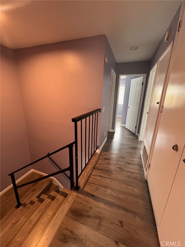 1007 Harrington Way, West Covina, CA 91792 - hall featuring dark wood-style flooring, baseboards, and an upstairs landing