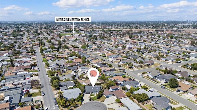 aerial view of property's location with nearby suburban area