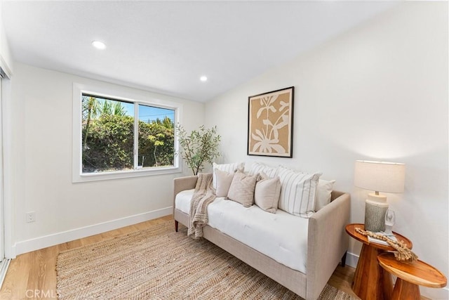 living room featuring wood finished floors, baseboards, and recessed lighting