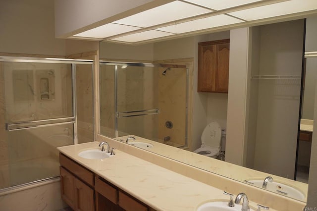 5845 Friars Rd Unit 1316, San Diego, CA 92110 - bathroom featuring double vanity and shower / bath combination with glass door