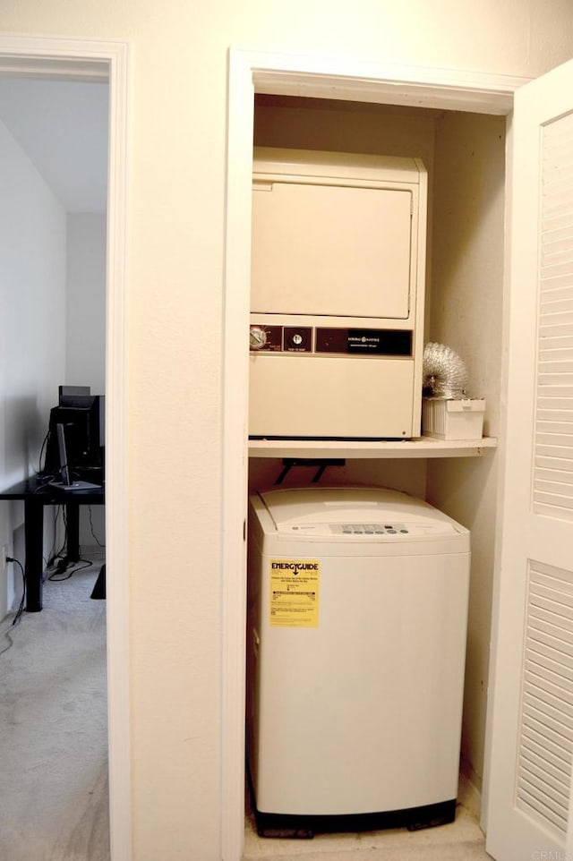 5845 Friars Rd Unit 1316, San Diego, CA 92110 - laundry room with stacked washer and clothes dryer and light carpet