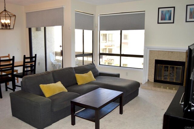 5845 Friars Rd Unit 1316, San Diego, CA 92110 - carpeted living area featuring a chandelier and a tiled fireplace