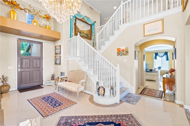 22541 Wakefield, Mission Viejo, CA 92692 - foyer featuring a towering ceiling, baseboards, arched walkways, stairway, and a chandelier