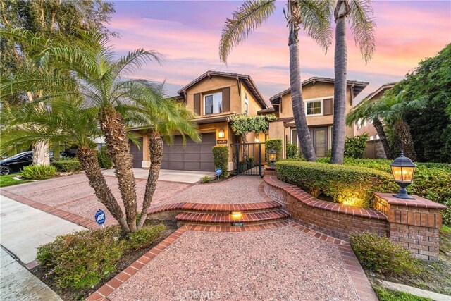 22541 Wakefield, Mission Viejo, CA 92692 - view of front of home with concrete driveway, a garage, stucco siding, a gate, and fence