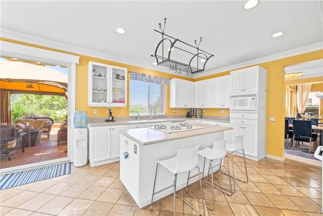 22541 Wakefield, Mission Viejo, CA 92692 - kitchen featuring white appliances, light countertops, recessed lighting, white cabinetry, and glass insert cabinets