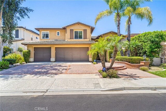 22541 Wakefield, Mission Viejo, CA 92692 - traditional-style house with an attached garage, stucco siding, and driveway