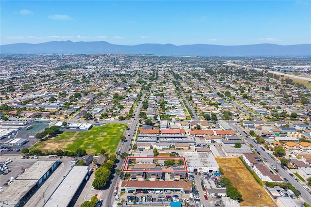 aerial view of property's location with a mountain backdrop and property boundaries highlighted
