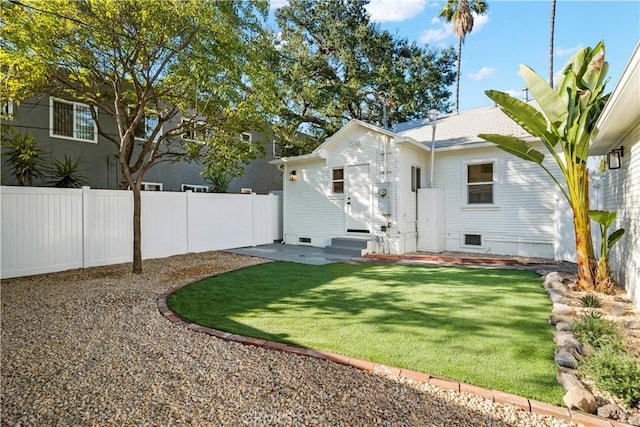 rear view of property with entry steps