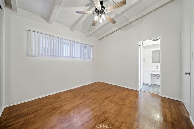 unfurnished room with ceiling fan, wood finished floors, and baseboards